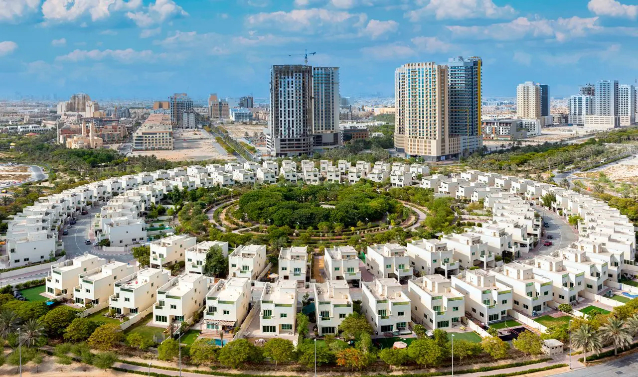 An aerial view of JVC villas and a few buildings in the background