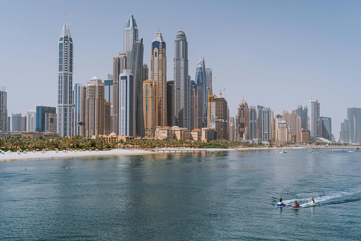 Image of Dubai marina and the sea with jet skiers
