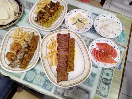 Al Ustad Kebab food pictures with kebabs and fries and salads