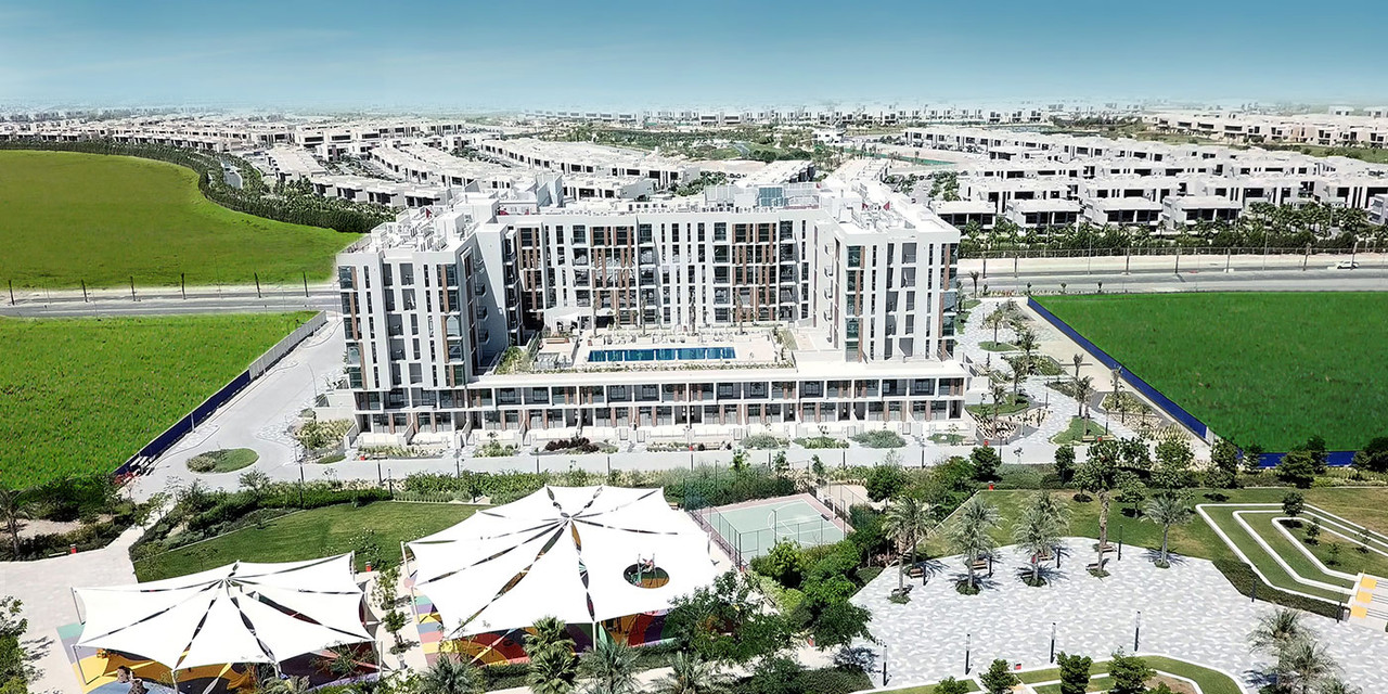 Aerial view of Mudon Views buildings and community behind it 