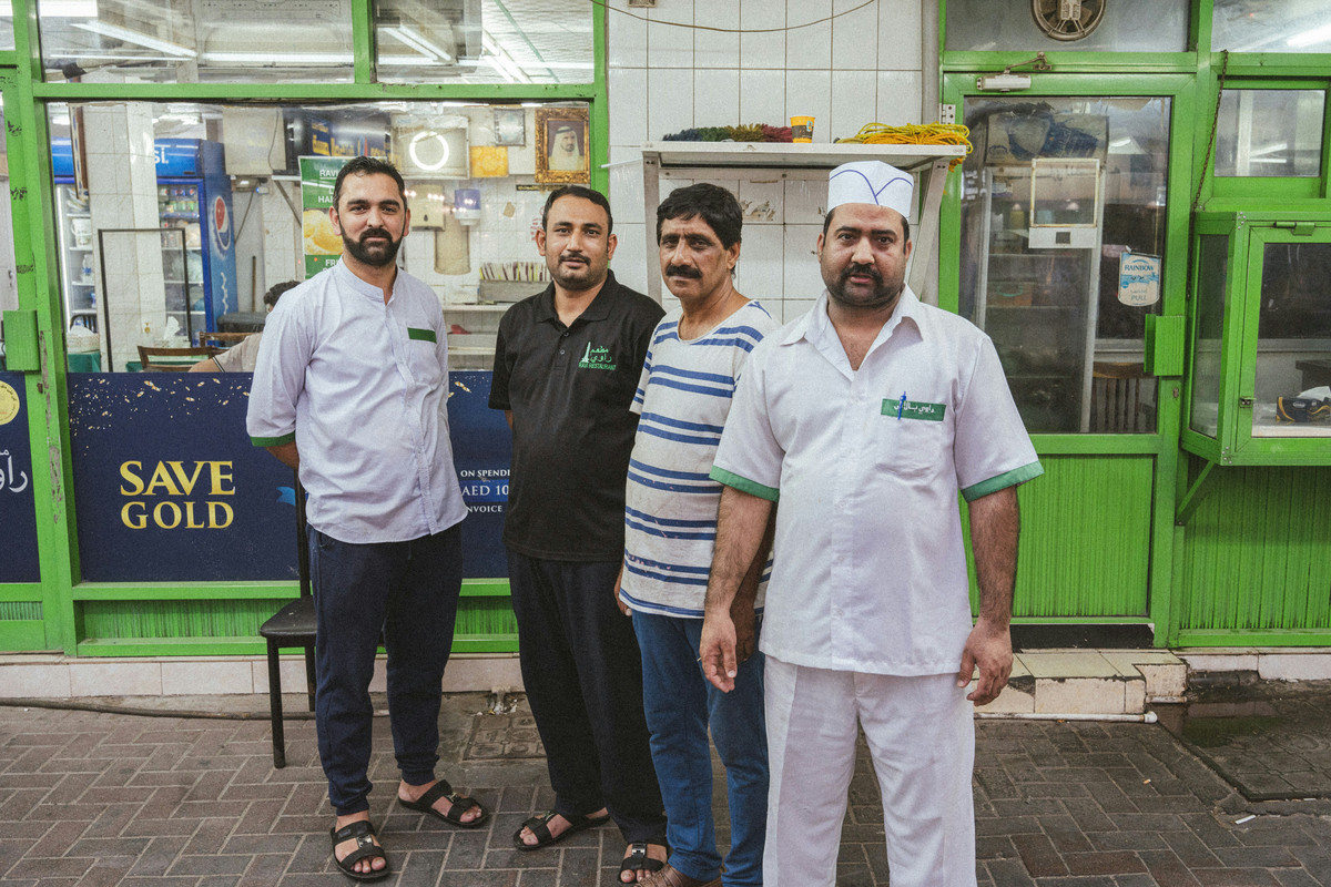 Ravi's restaurant in Dubai with cooks standing outside