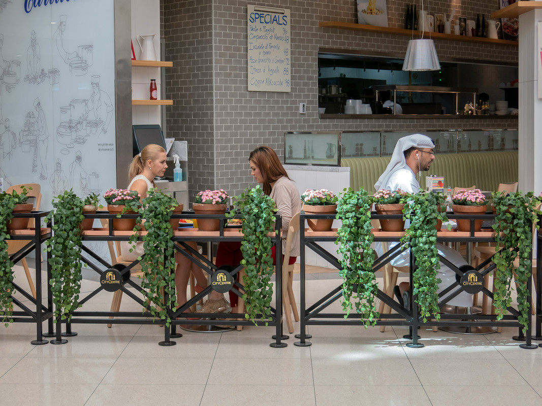 image of a local and european ladies eating in dubai
