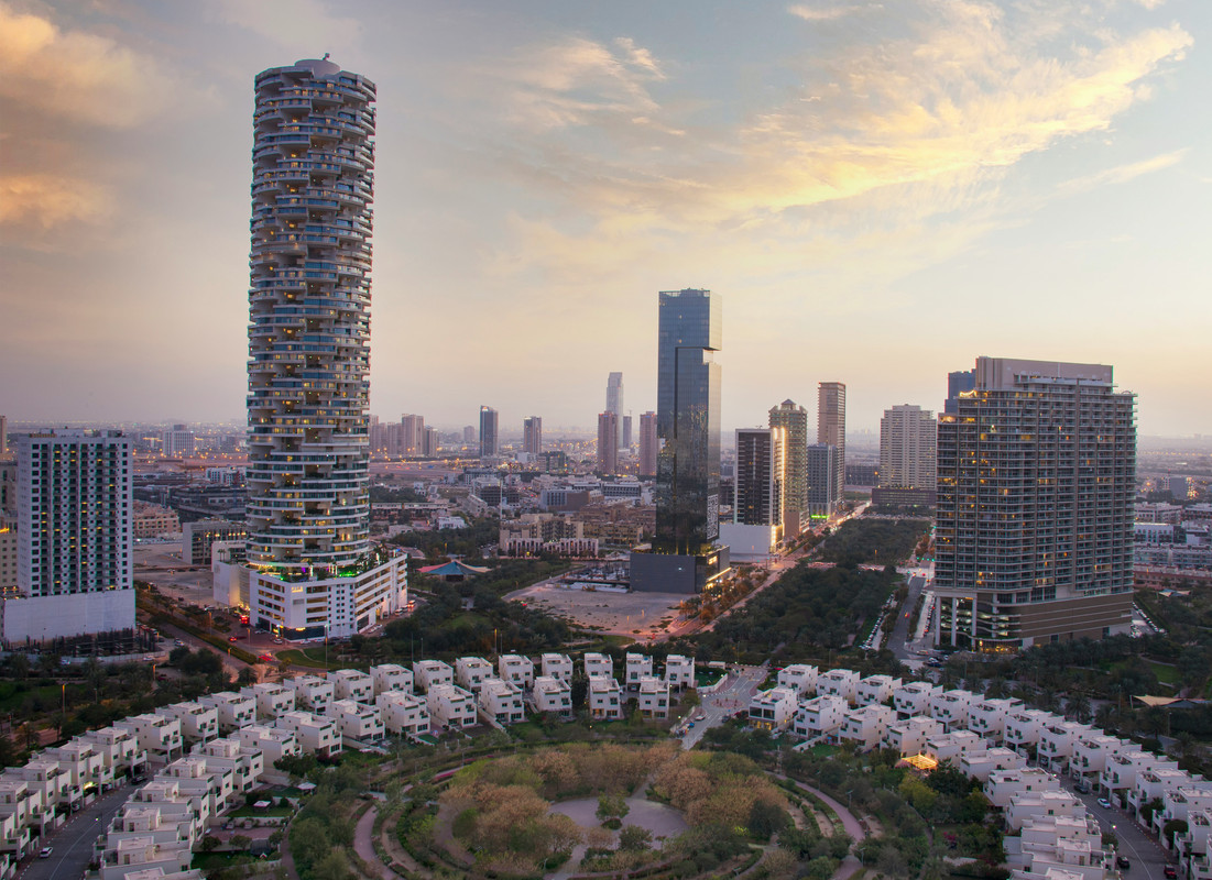 An image of Jumeirah Village Circle with a circle of villas during sunset time in Dubai