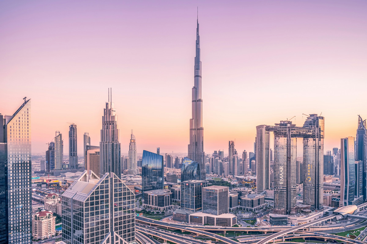 A picture of Downtown Dubai at dusk