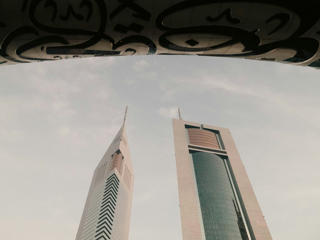 Emirates Towers with Museum of the future backdrop.