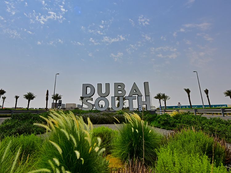 Dubai South sign with landscaping in front