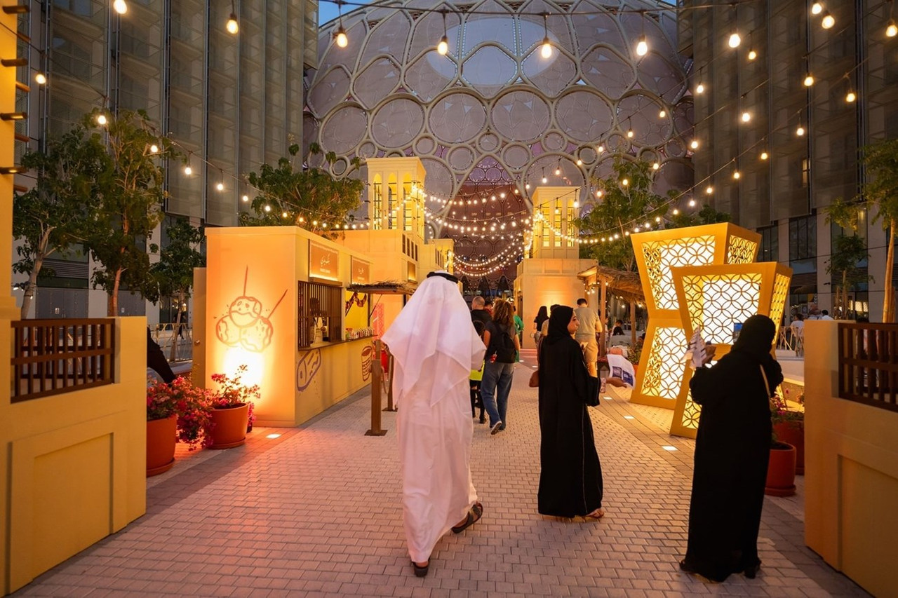 A family walking around an Eid market in Expo City Dubai